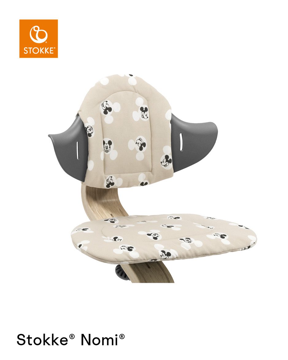 Stokke® Nomi® Chair Natural-Grey with Disney Cushion Mickey Signature.